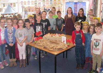 Hazel with their Poppy Fields themed cakes.