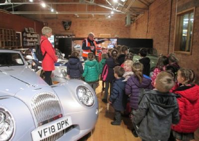 Children having a tour of the Morgan Motor factory.