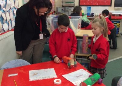 Professor Rodriquez Falcon working with some children.