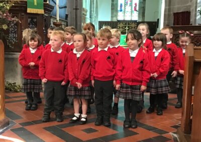 Class 1 singing 'What do we do at harvest time'