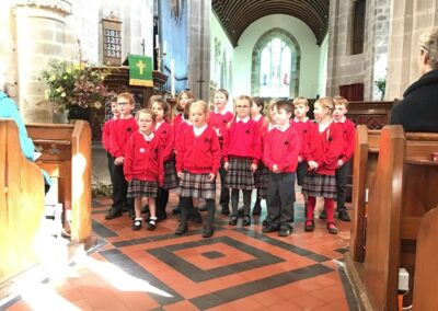 Class 2 singing 'Harvest song'